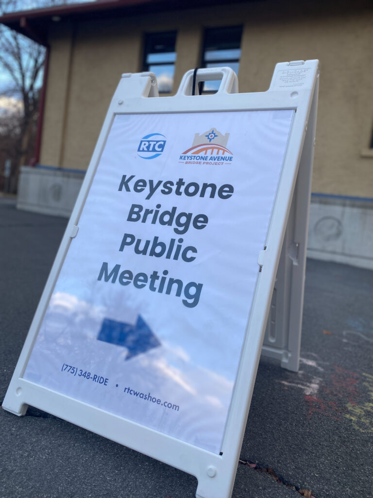 An image depicting a sign that reads "Keystone Bridge Public Meeting"