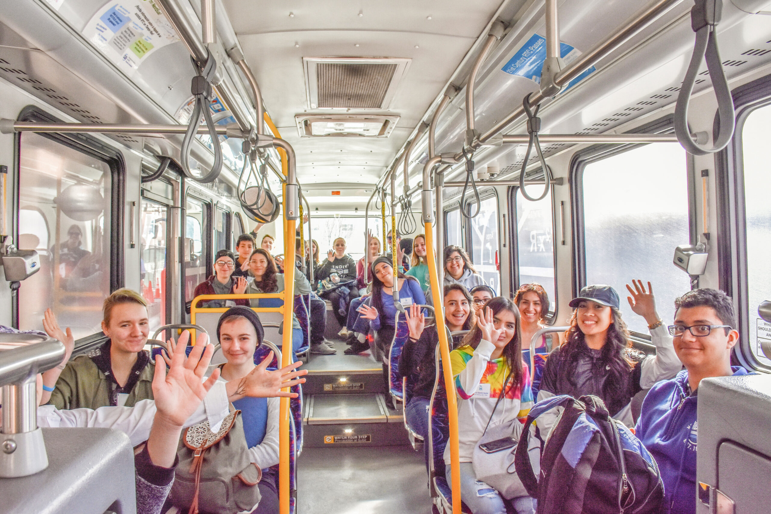 Bus with kids waving